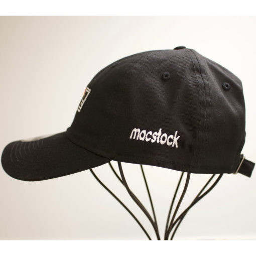 Macstock Hat Pride - Side View - Peace Love Mac logo in white. Heart in rainbow colors. Macstock in white on side panel.